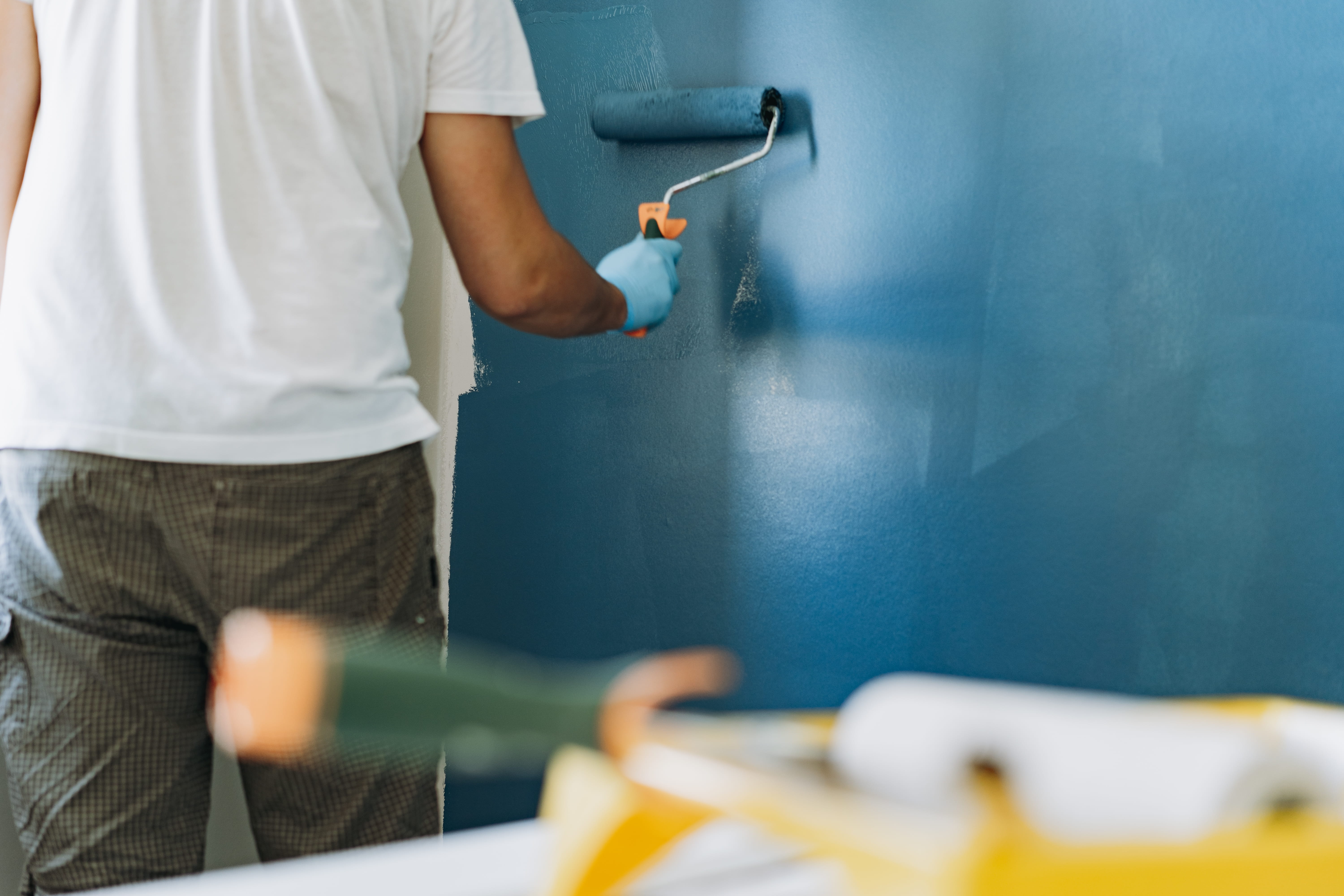 Interior wall being painted blue