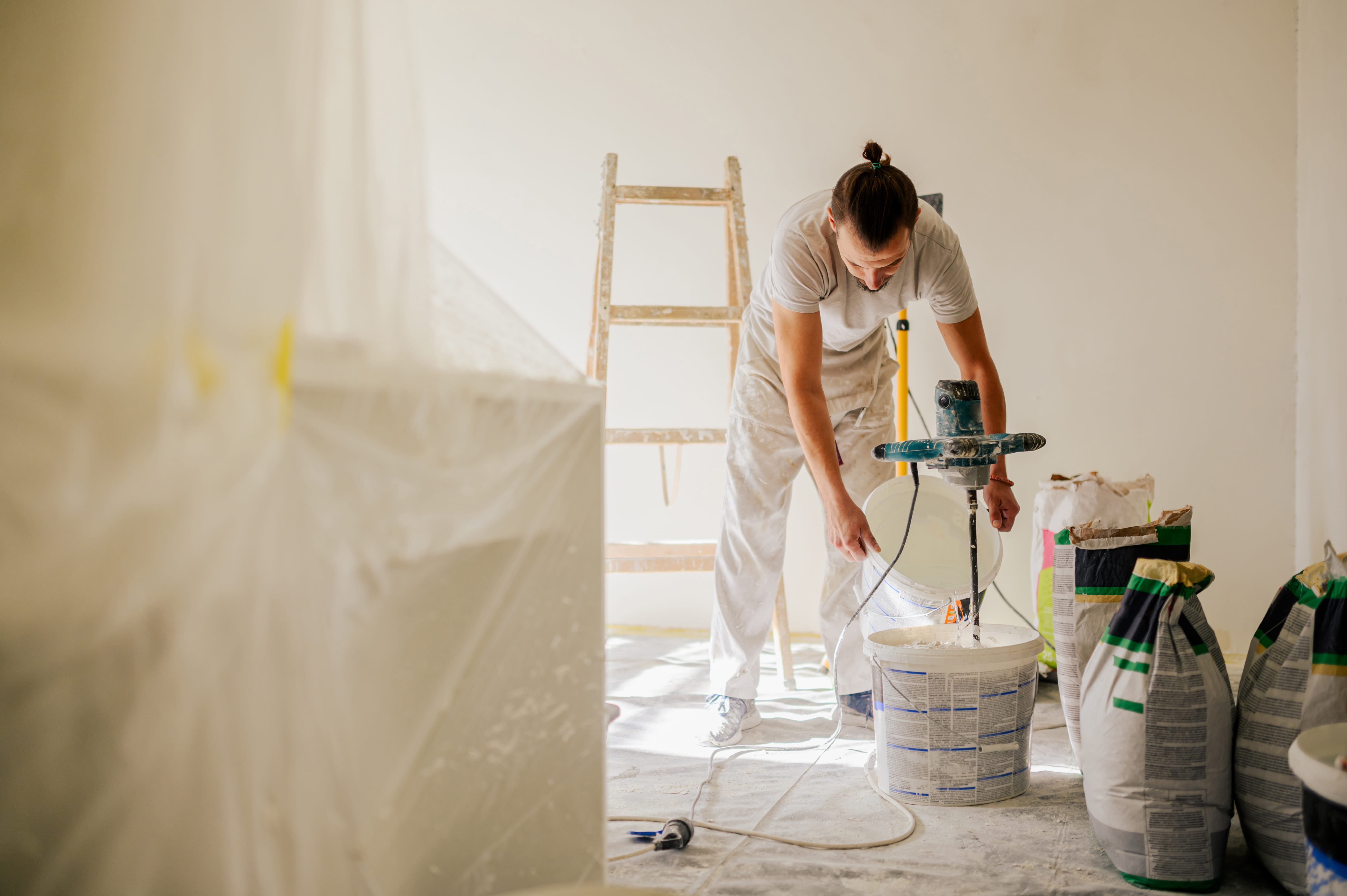 Professional painter mixing high-quality paint