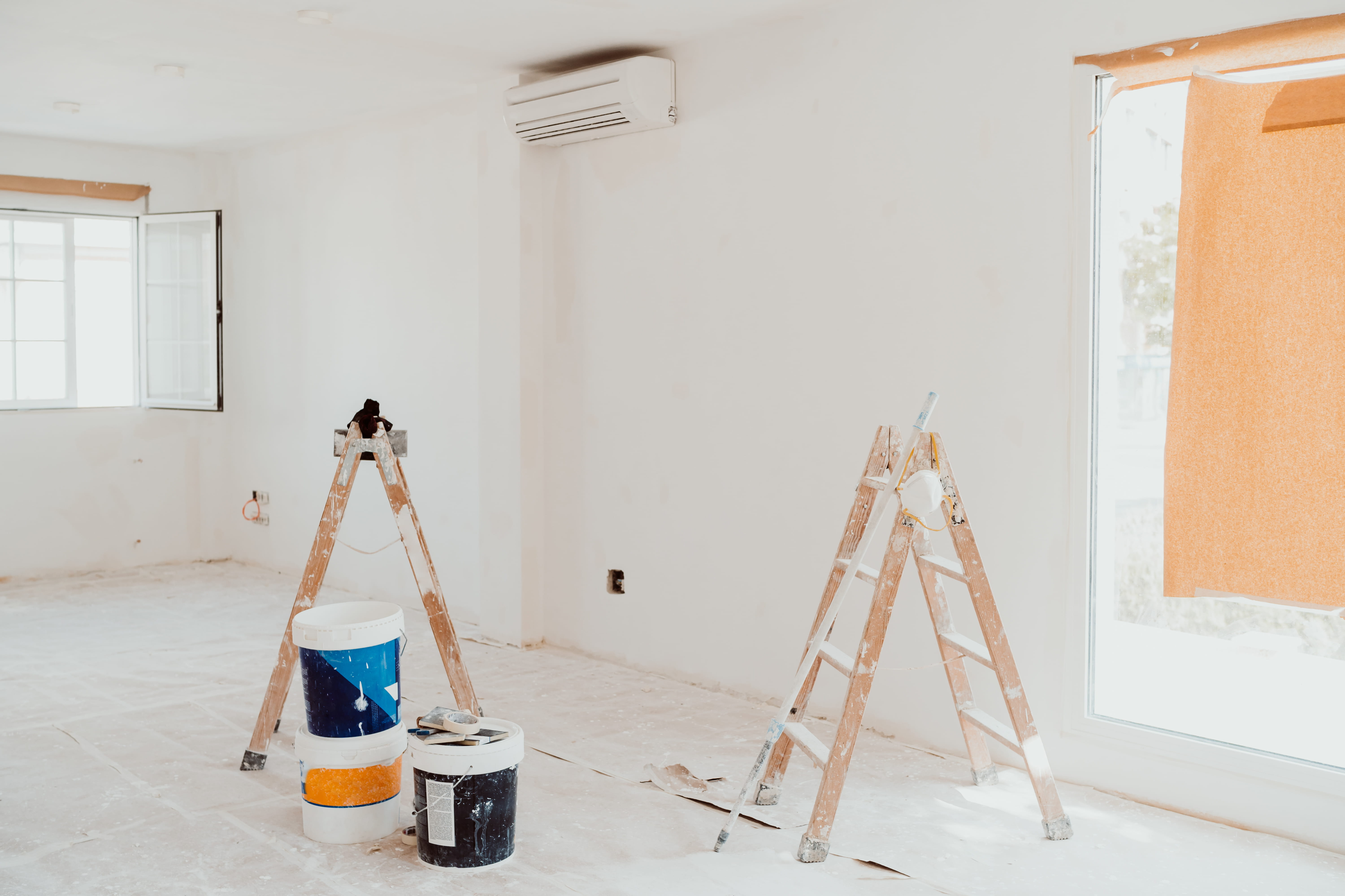 Commercial painting project with ladders
